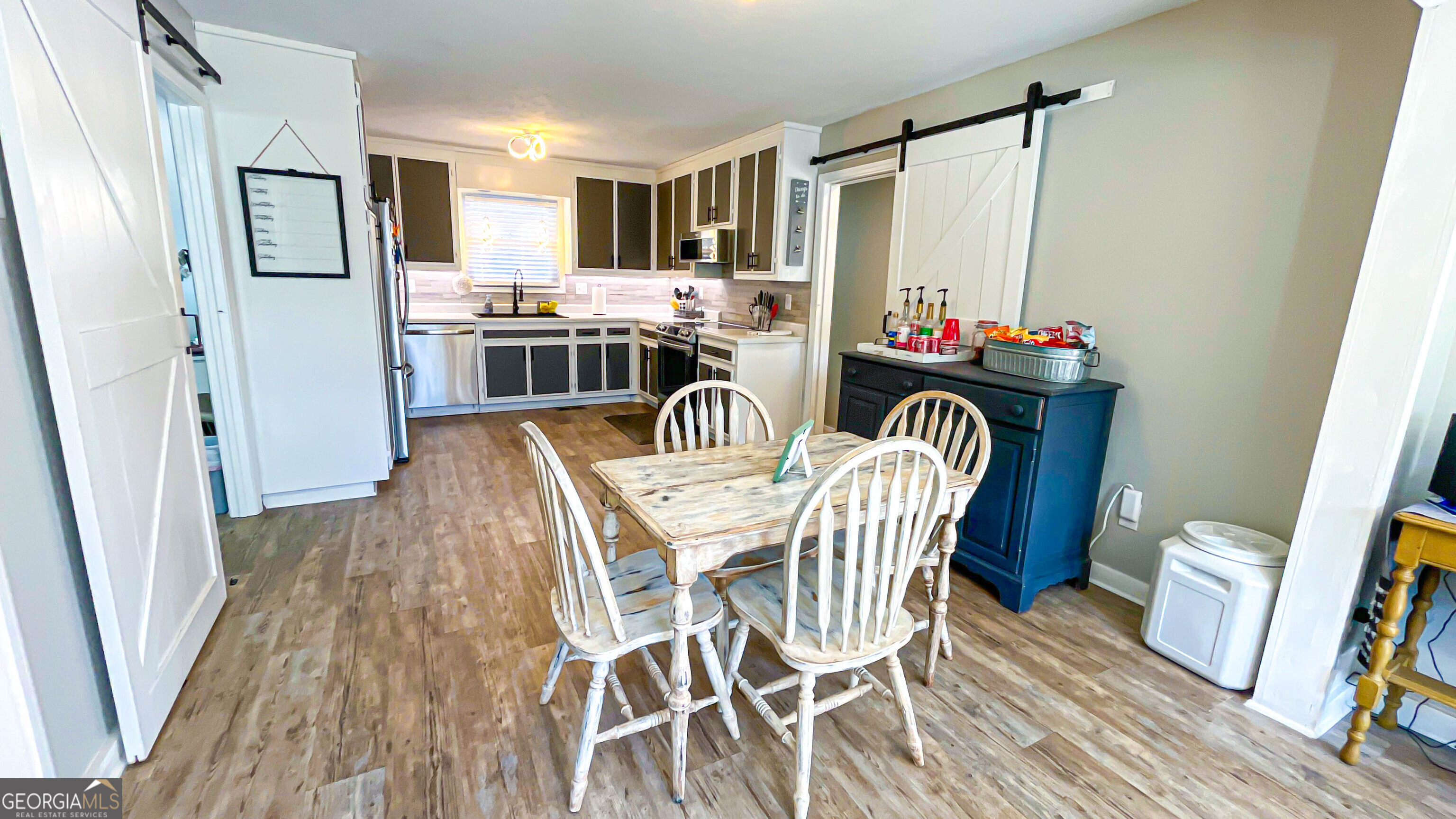 587 Highway 41 Milner, GA 30257 - Photo 45 of 172 a dining room with furniture and wooden floor