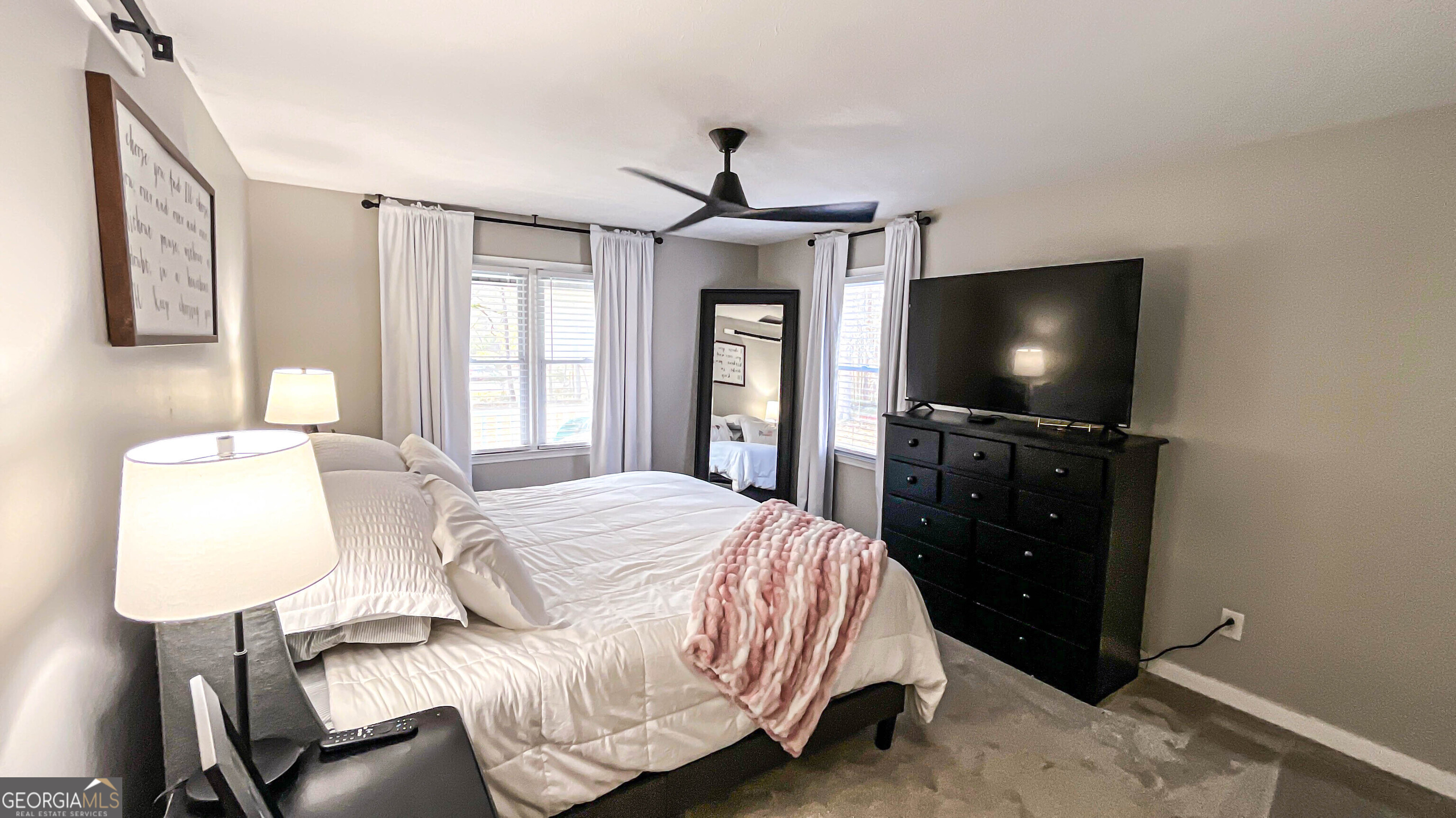 587 Highway 41 Milner, GA 30257 - Photo 48 of 172 a bedroom with a bed and a flat screen tv