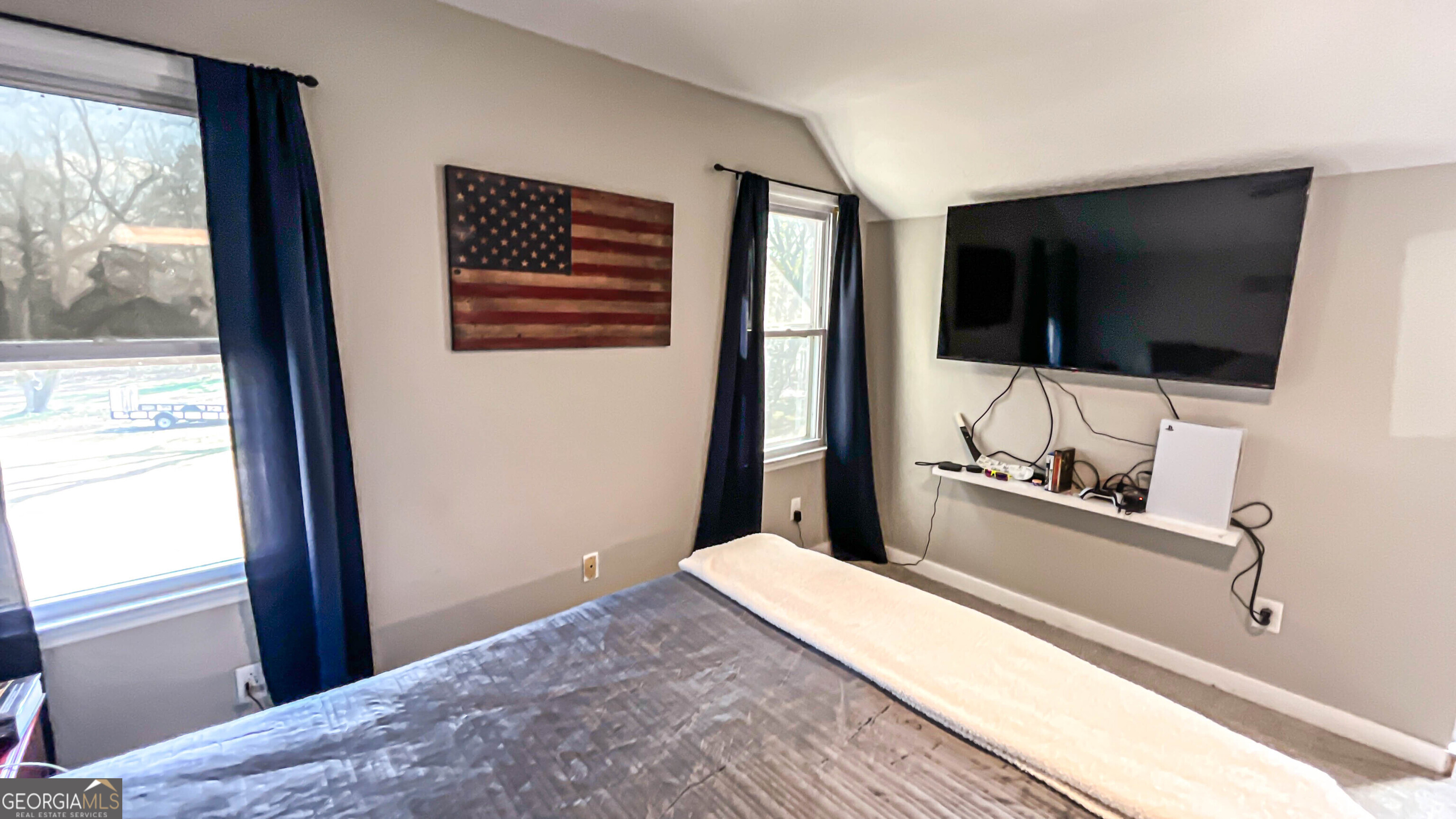 587 Highway 41 Milner, GA 30257 - Photo 67 of 172 a bedroom with a bed and a flat screen tv