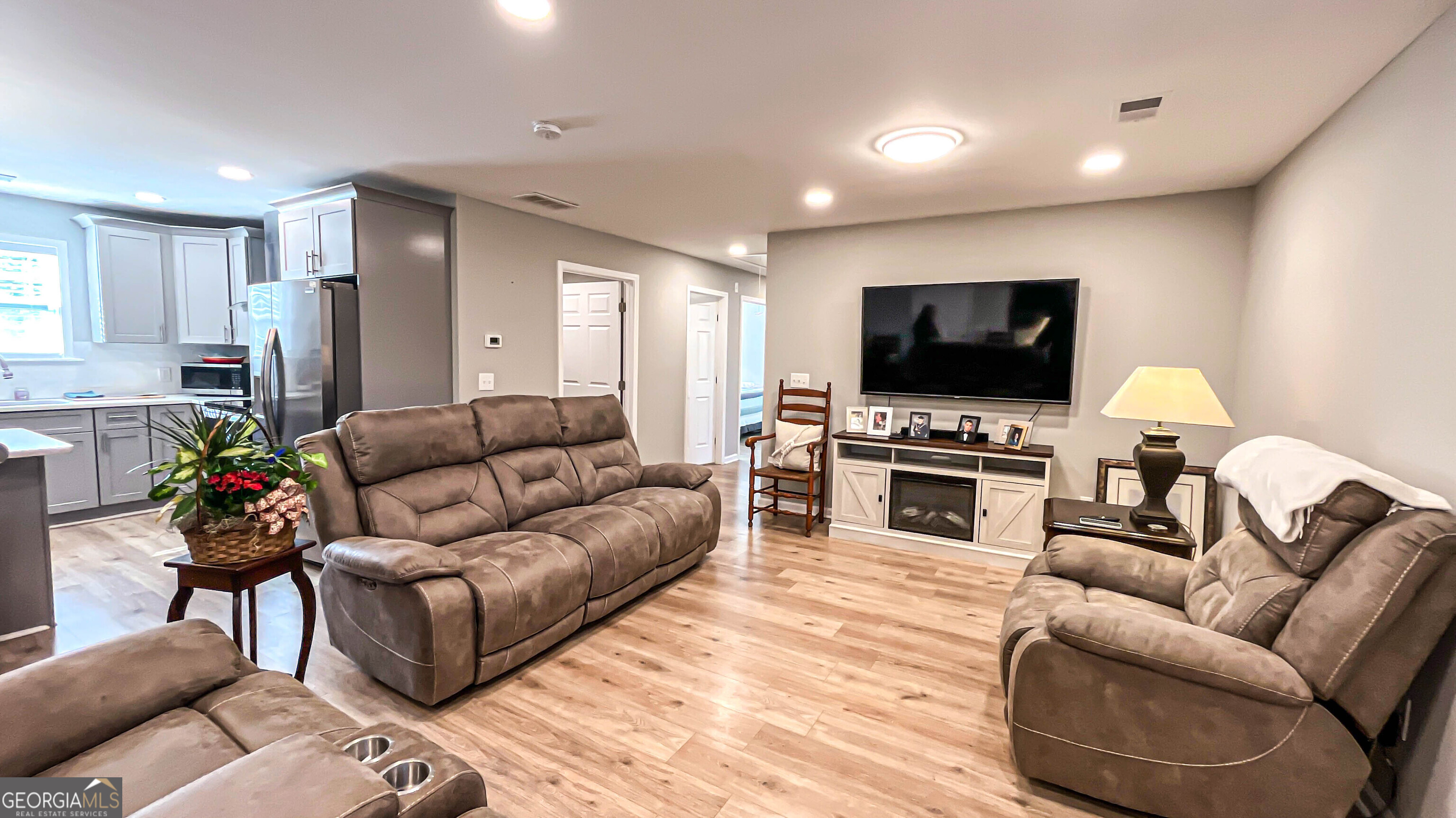 587 Highway 41 Milner, GA 30257 - Photo 75 of 172 a living room with furniture and a flat screen tv