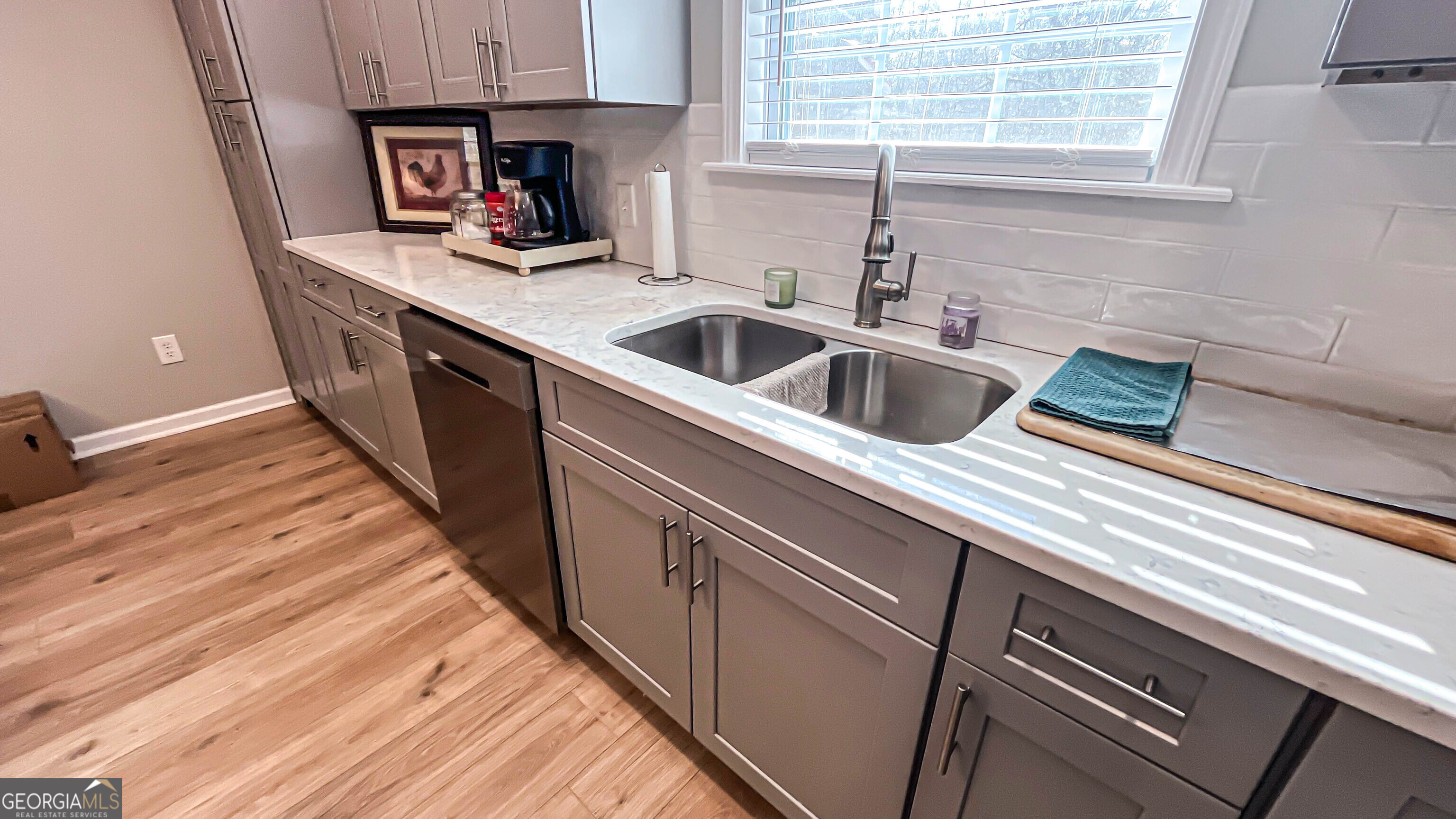 587 Highway 41 Milner, GA 30257 - Photo 86 of 172 a kitchen with stainless steel appliances granite countertop a sink and a stove