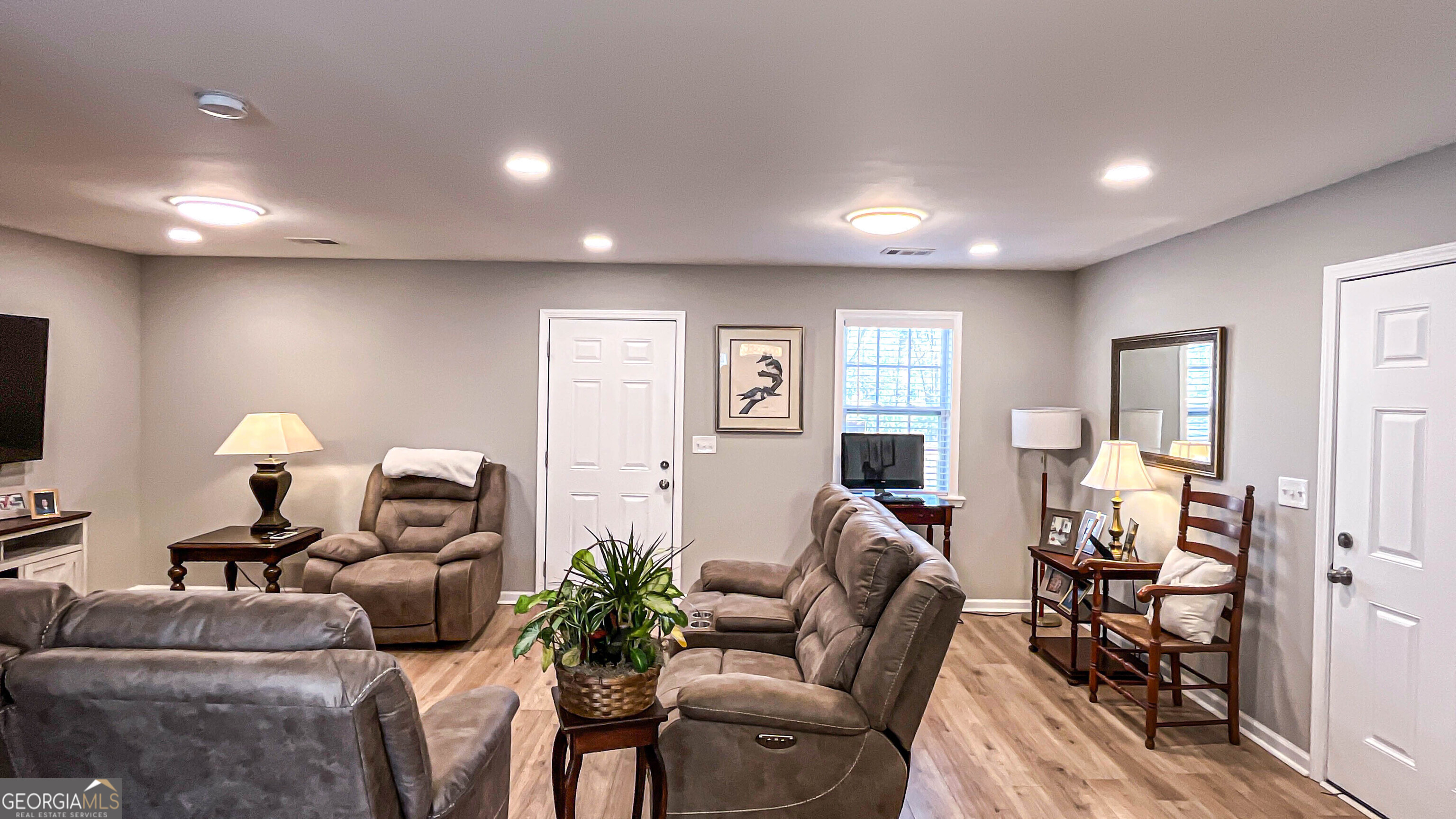 587 Highway 41 Milner, GA 30257 - Photo 98 of 172 a living room with furniture and a flat screen tv