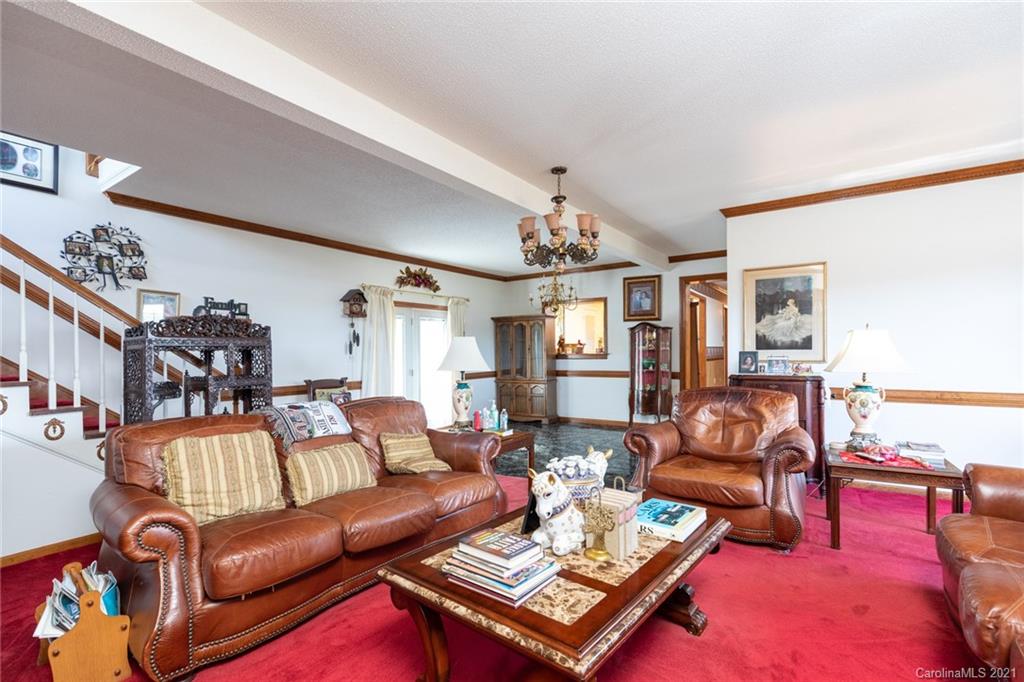 6013 Laney Rogers Road Monroe, NC 28112 - Photo 23 of 43 a living room with furniture a rug and a table