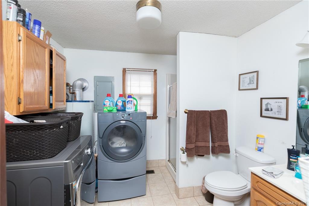 6013 Laney Rogers Road Monroe, NC 28112 - Photo 28 of 43 a bathroom with a toilet a sink and a mirror