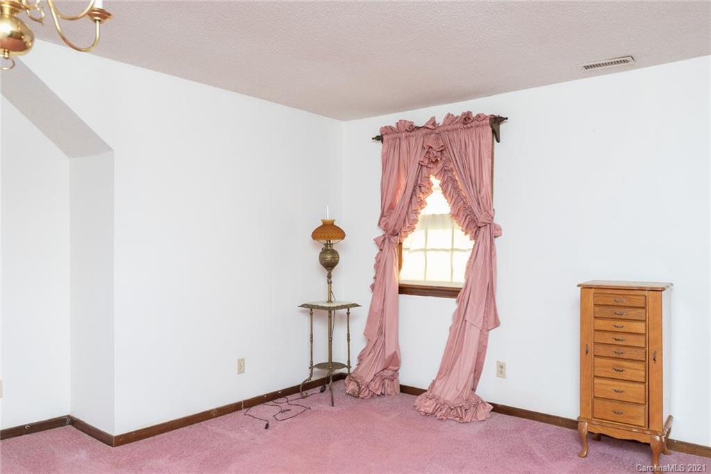 6013 Laney Rogers Road Monroe, NC 28112 - Photo 32 of 43 a view of a room with wooden floor and windows