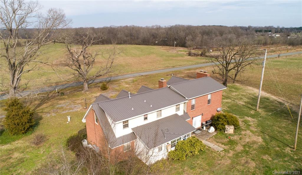 6013 Laney Rogers Road Monroe, NC 28112 - Photo 7 of 43 an aerial view of residential houses with outdoor space