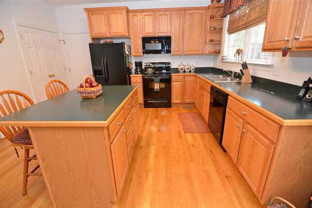 259 Patterson Mill Road Grottoes, VA 24441 - Photo 16 of 26 a kitchen with stainless steel appliances granite countertop a sink a stove and a refrigerator