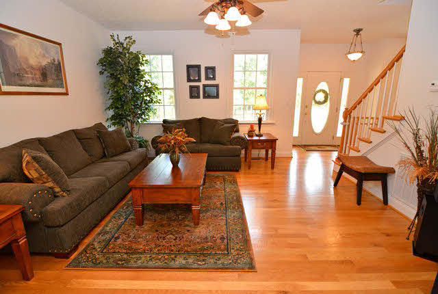 259 Patterson Mill Road Grottoes, VA 24441 - Photo 10 of 26 a living room with furniture a dining table and a chandelier
