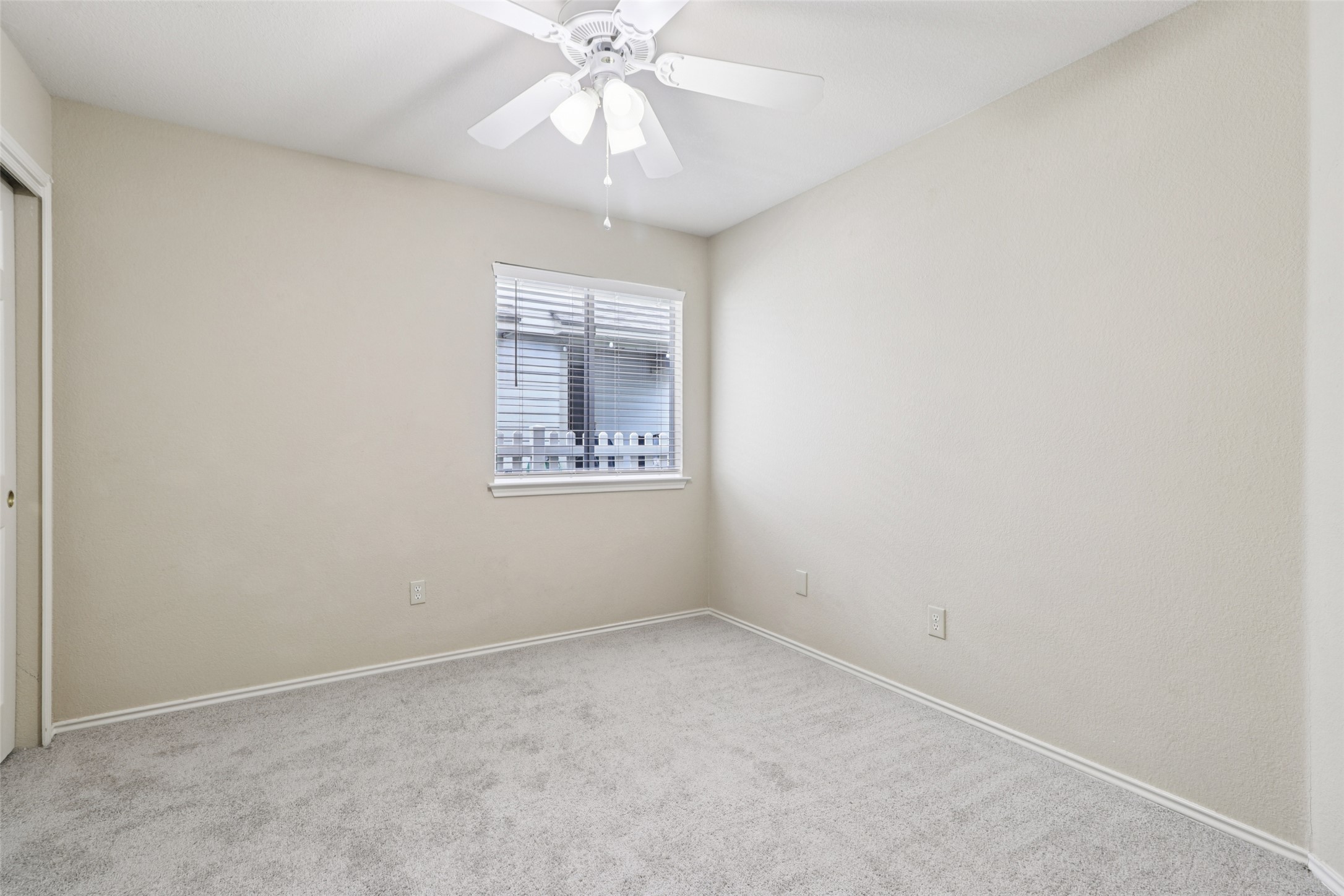 700 Scheel Road Kyle, TX 78640 - Photo 33 of 39 This room features light-colored walls and grey carpet flooring