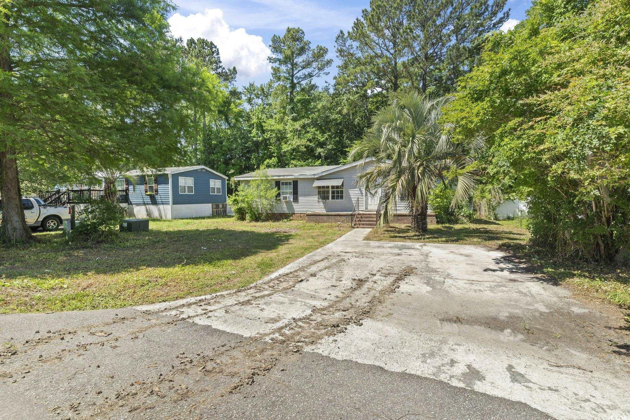 718 Reef Road Myrtle Beach, SC 29588 - Photo 1 of 20 Manufactured / mobile home featuring a front yard