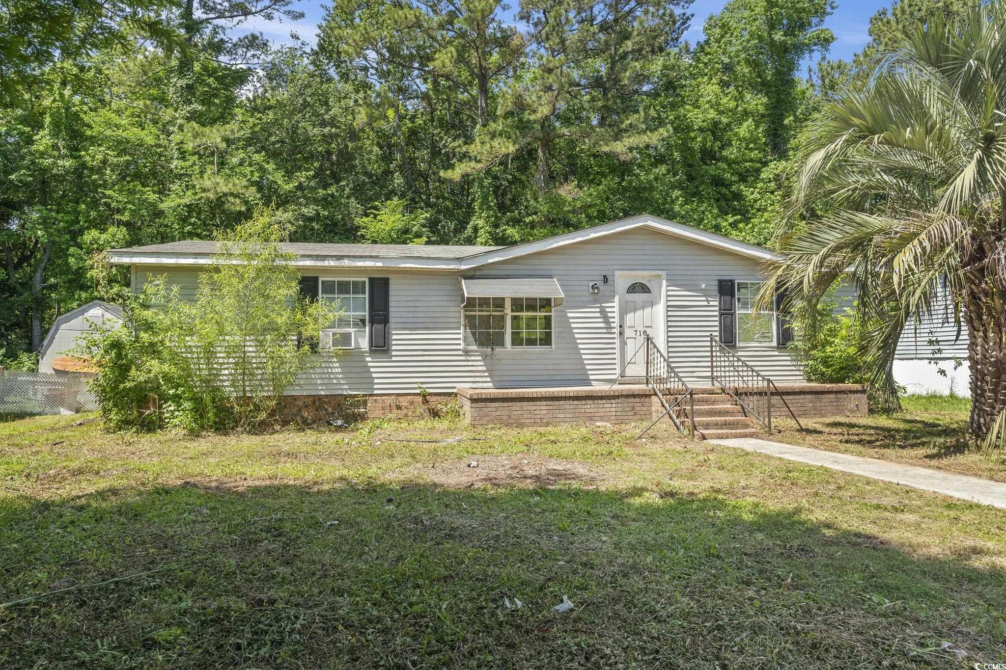 718 Reef Road Myrtle Beach, SC 29588 - Photo 2 of 20 Single story home with a front lawn
