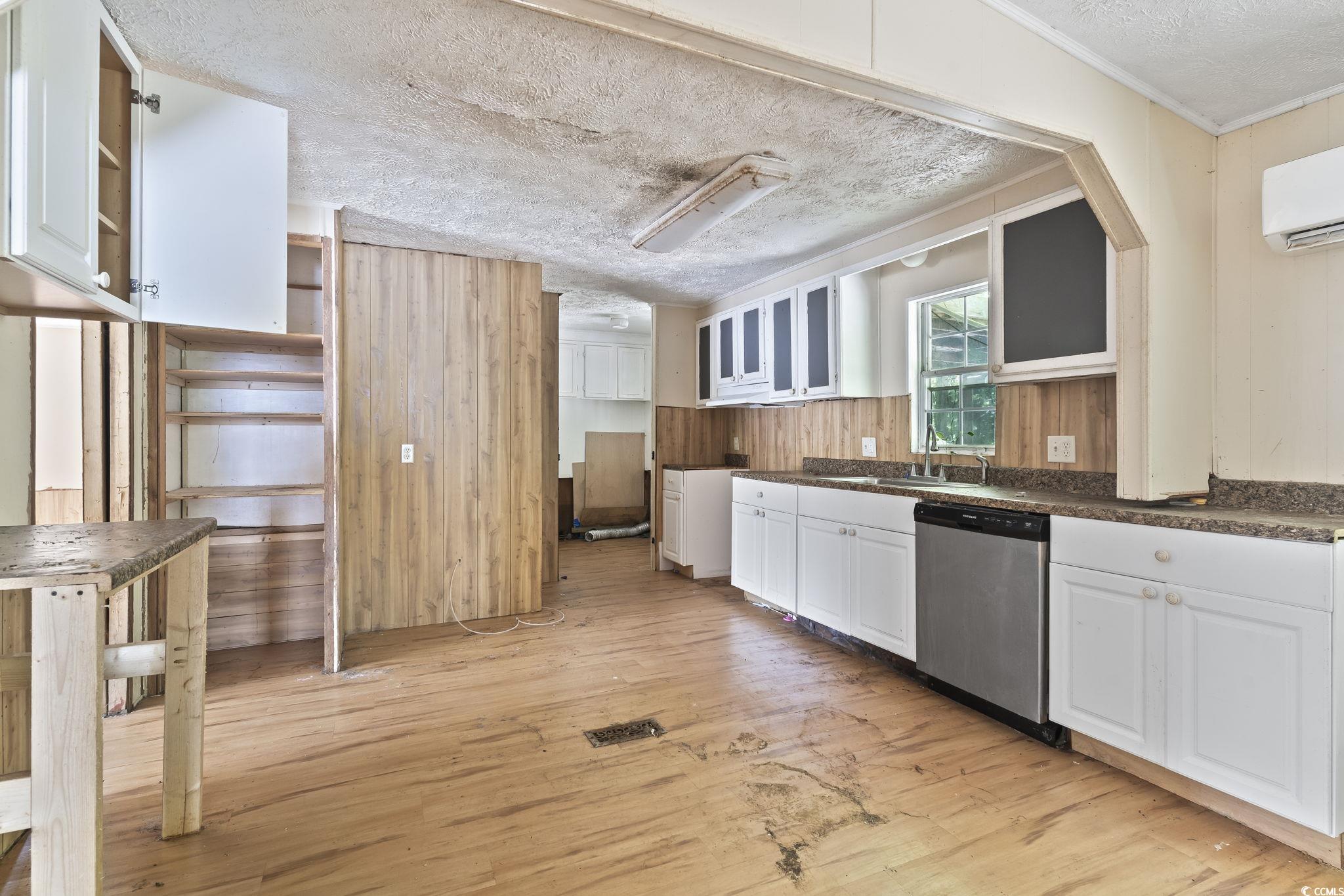 718 Reef Road Myrtle Beach, SC 29588 - Photo 8 of 20 Kitchen featuring stainless steel dishwasher, whit