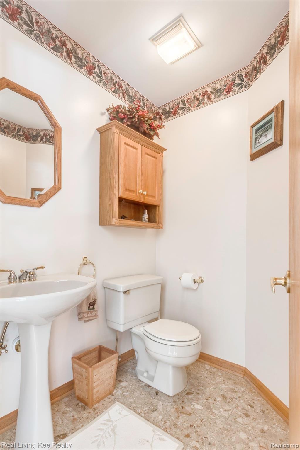 5775 McIntyre Road North Street, MI 48049 - Photo 11 of 65 5775 McIntyre Rd half bath off entryway...left hand side as you are looking at dining room.JPG
