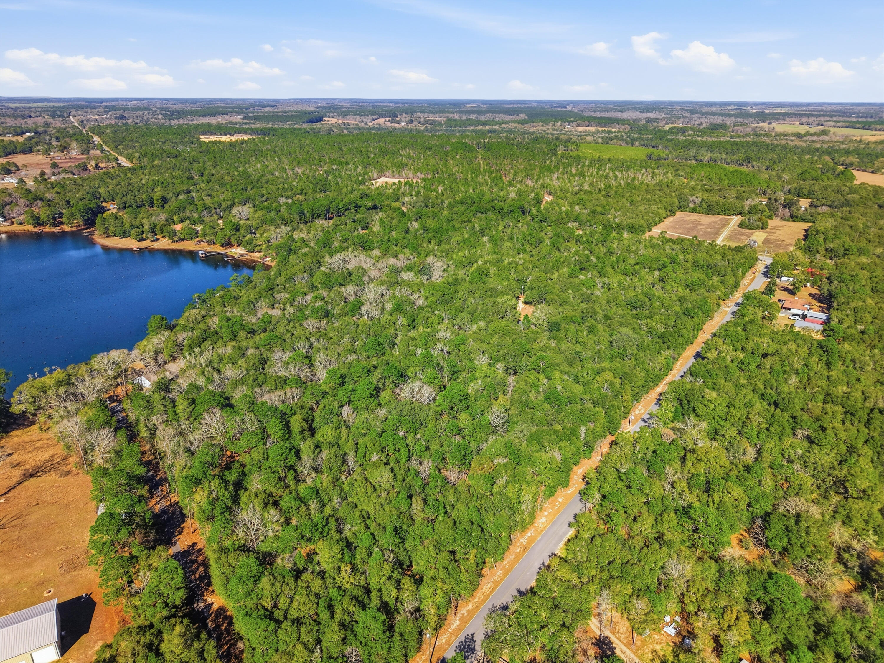 5-ac Holley King Road DeFuniak Springs, FL 32433 - Photo 9 of 13 a view of a lake with a yard
