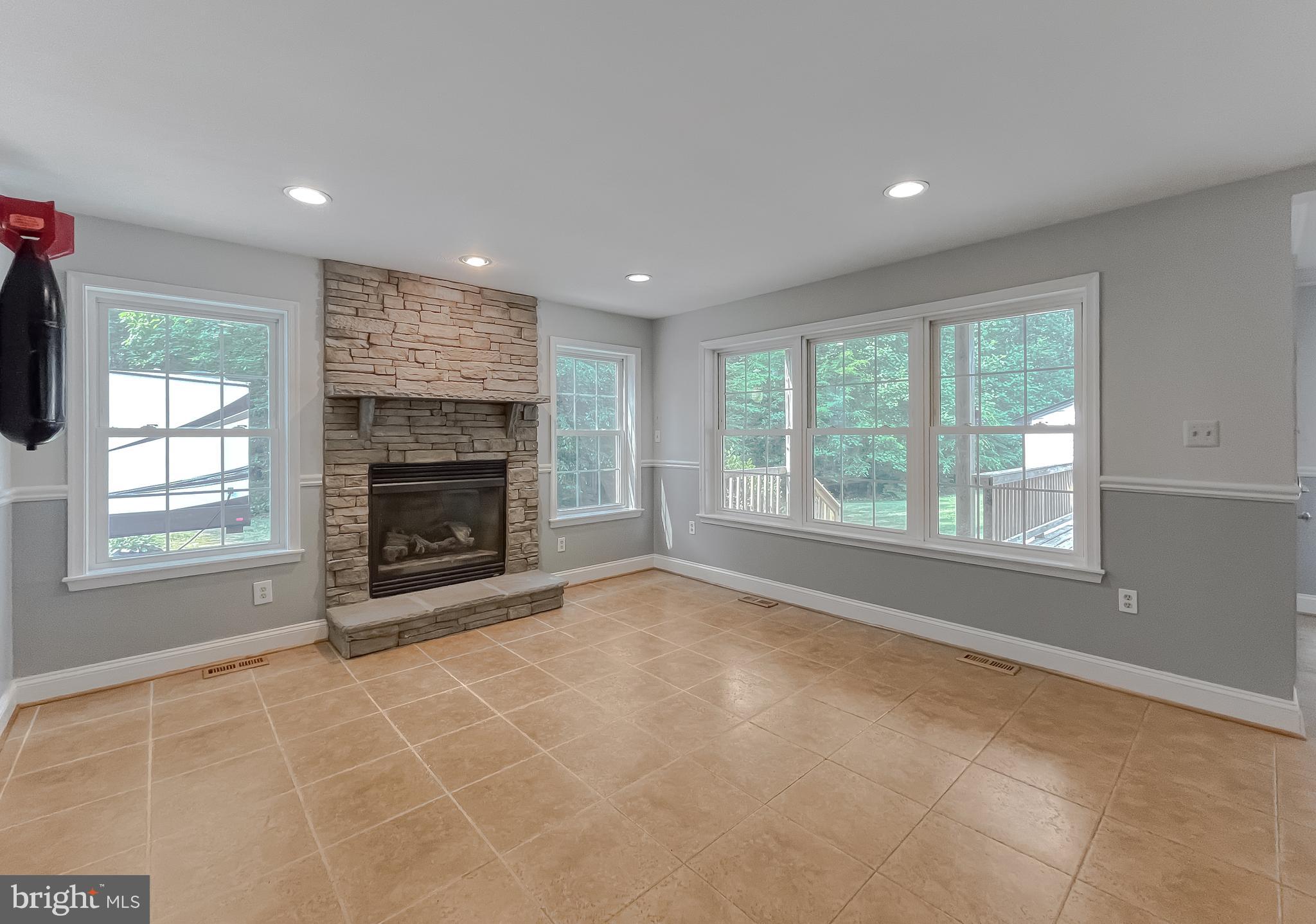 24151 McIntosh Road Hollywood, MD 20636 - Photo 33 of 103 morning room with gas fireplace