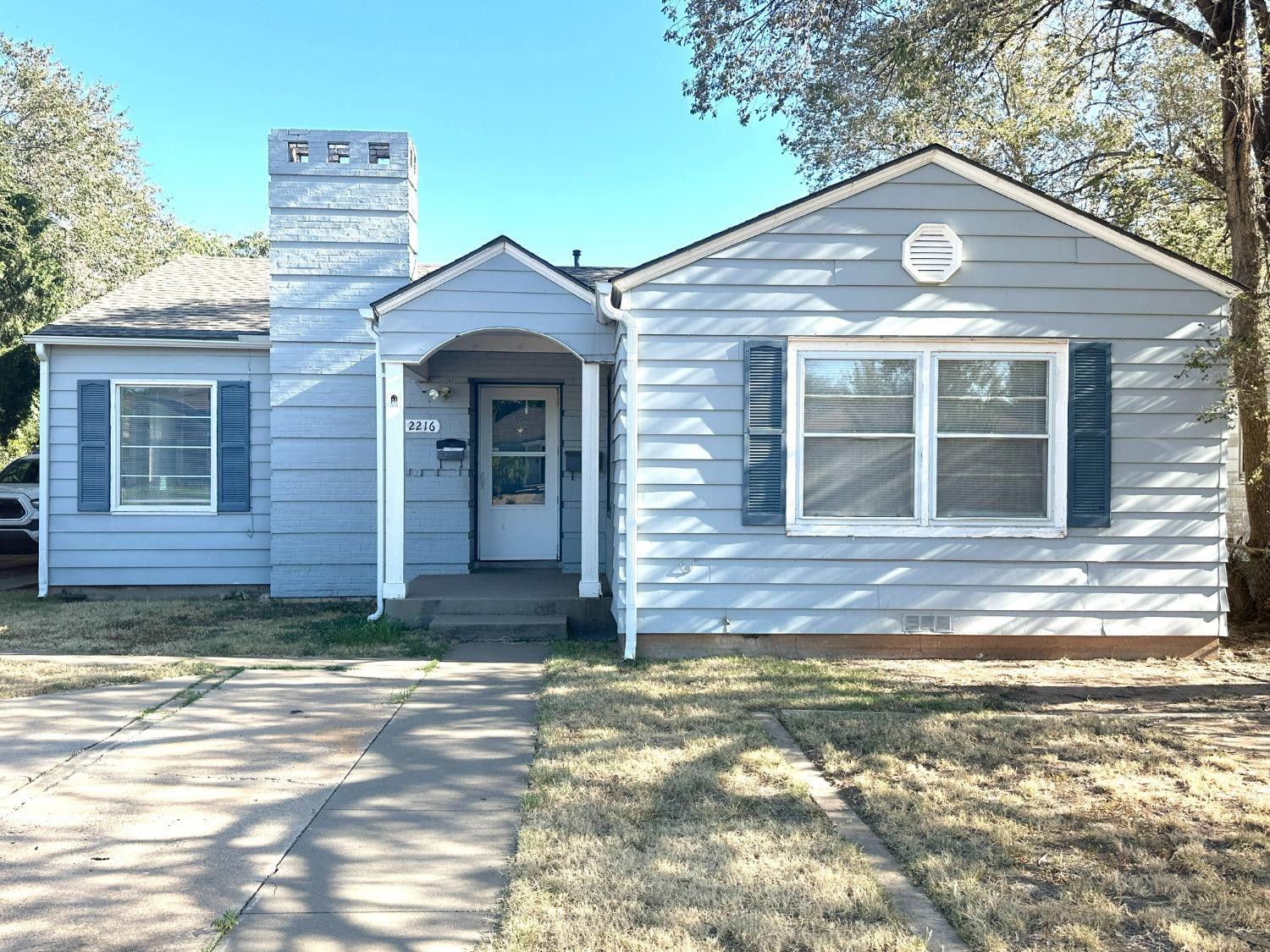 2216 30th Street, Unit FRONT Lubbock, TX 79411 - Photo 1 of 11 a front view of a house with a yard