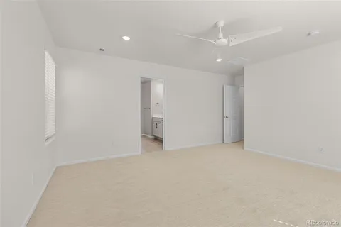 a spacious bathroom with a double vanity sink mirror and bathtub