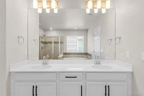 a bathroom with a bath tub and a shower