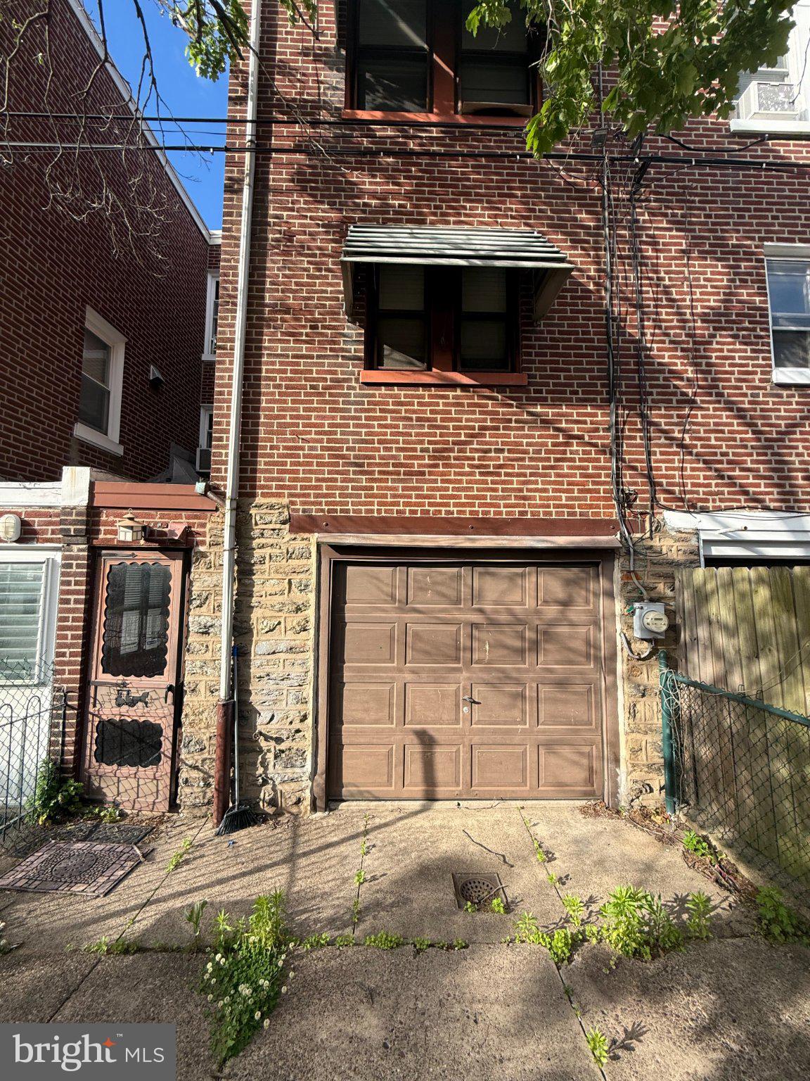 3148 Rawle Street Philadelphia, PA 19149 - Photo 31 of 33 Charming brick facade with garage door.