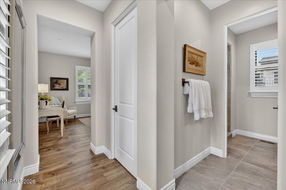 5096 Bordeaux Court Reno, NV 89511 - Photo 48 of 70 a view of a hallway with wooden floor and a living room