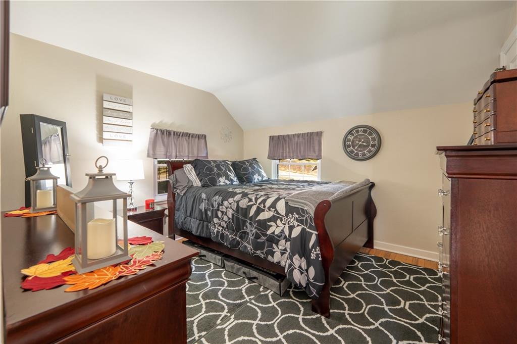 290 Barclay Avenue Pittsburgh, PA 15221 - Photo 15 of 29 a bedroom with a bed and a table in it