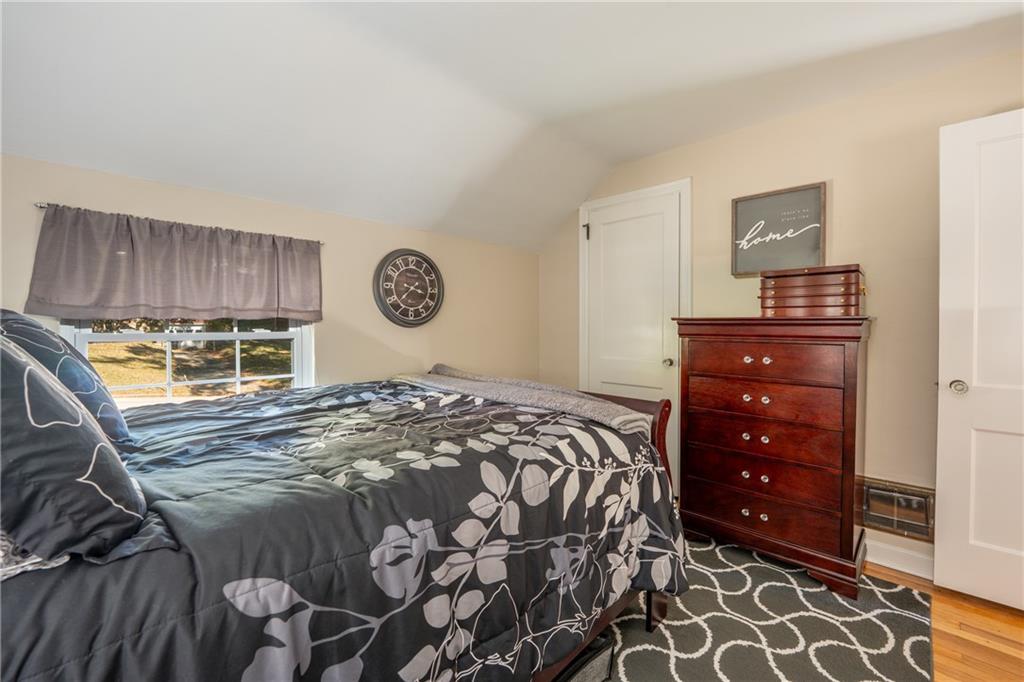 290 Barclay Avenue Pittsburgh, PA 15221 - Photo 16 of 29 a bedroom with a bed and a dresser