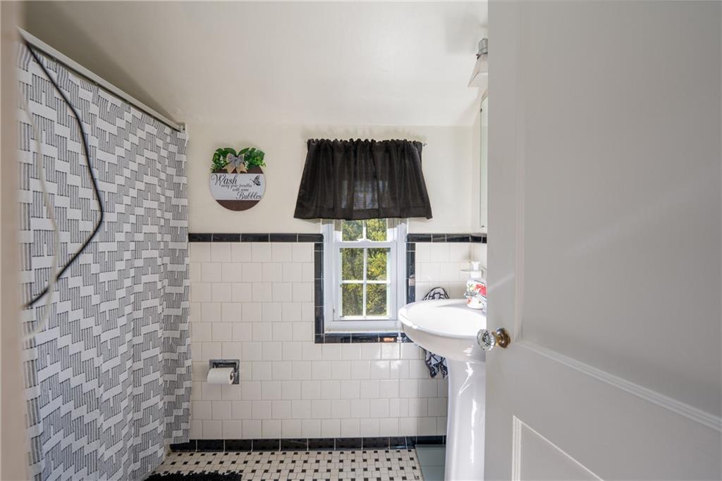 290 Barclay Avenue Pittsburgh, PA 15221 - Photo 20 of 29 a bathroom with a sink and a mirror
