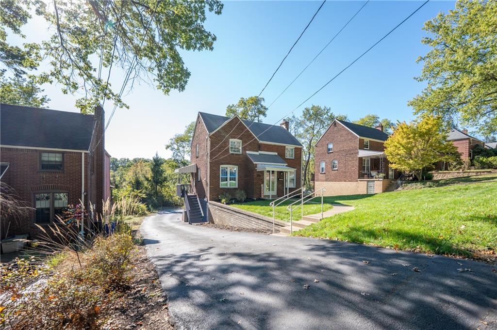 290 Barclay Avenue Pittsburgh, PA 15221 - Photo 4 of 29 a view of a house with a yard and tree s
