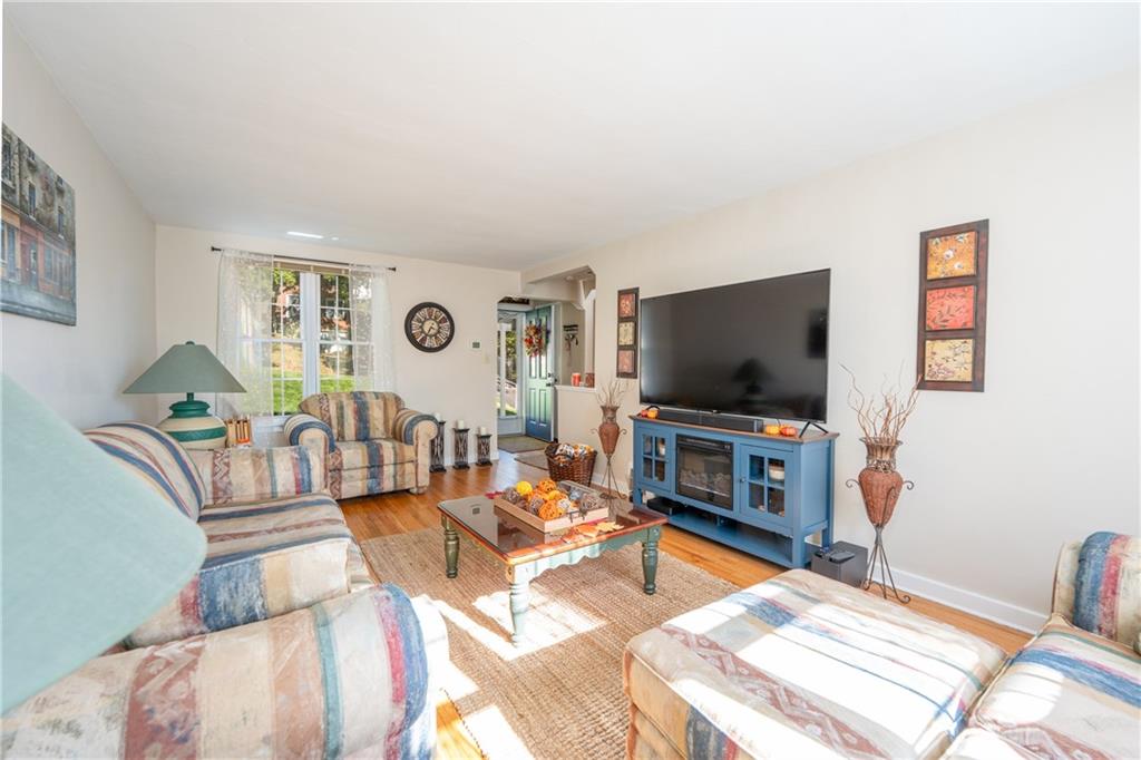 290 Barclay Avenue Pittsburgh, PA 15221 - Photo 6 of 29 a living room with furniture and a flat screen tv