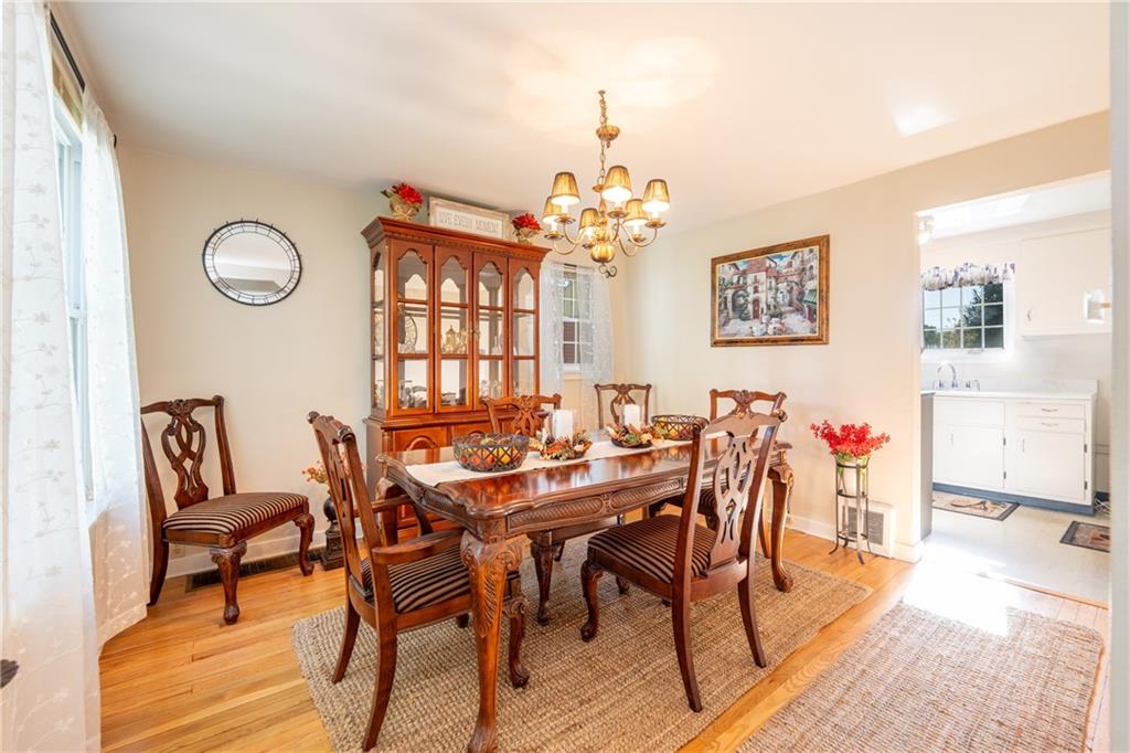 290 Barclay Avenue Pittsburgh, PA 15221 - Photo 9 of 29 a view of a dining room with furniture and wooden floor
