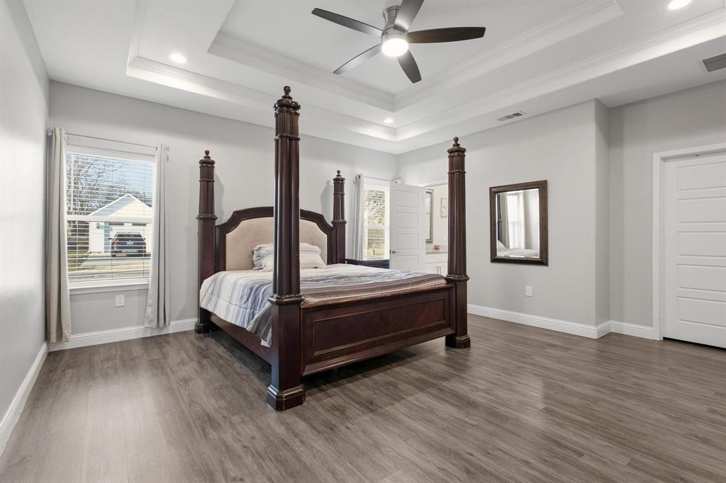 104 4th Street Trenton, TX 75490 - Photo 14 of 33 a bedroom with a large bed and a window