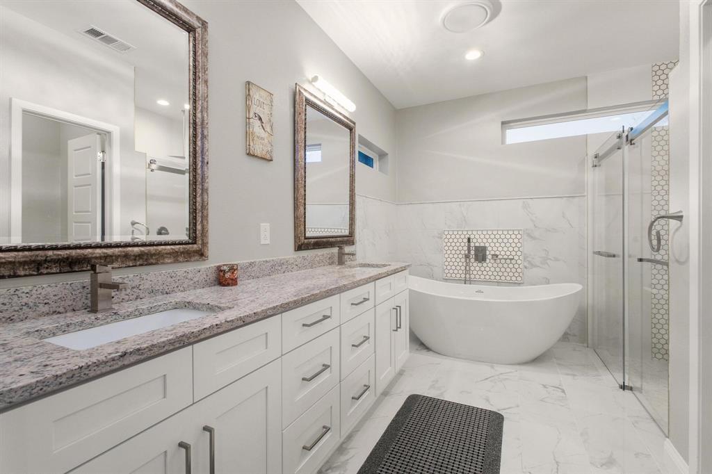 104 4th Street Trenton, TX 75490 - Photo 15 of 33 a bathroom with a granite countertop sink mirror and bathtub