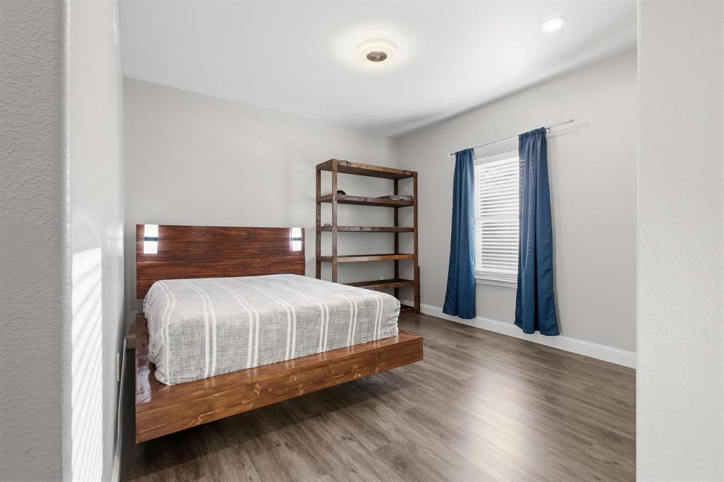104 4th Street Trenton, TX 75490 - Photo 23 of 33 a bedroom with a bed and a window