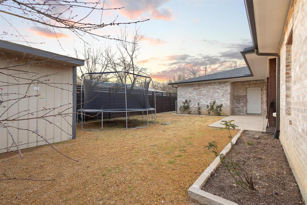104 4th Street Trenton, TX 75490 - Photo 26 of 33 a view of a house with a yard