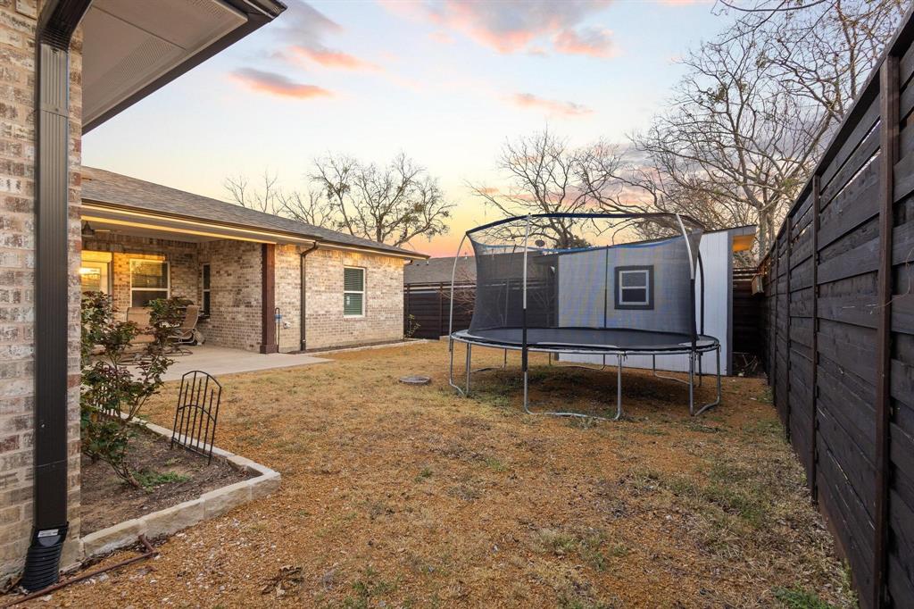 104 4th Street Trenton, TX 75490 - Photo 27 of 33 a house view with a backyard space