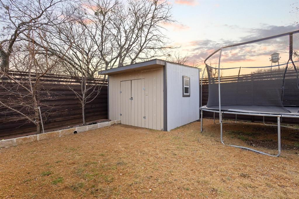 104 4th Street Trenton, TX 75490 - Photo 30 of 33 a view of a backyard