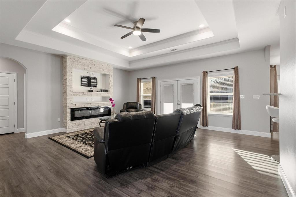 104 4th Street Trenton, TX 75490 - Photo 5 of 33 a living room with furniture and a wooden floor
