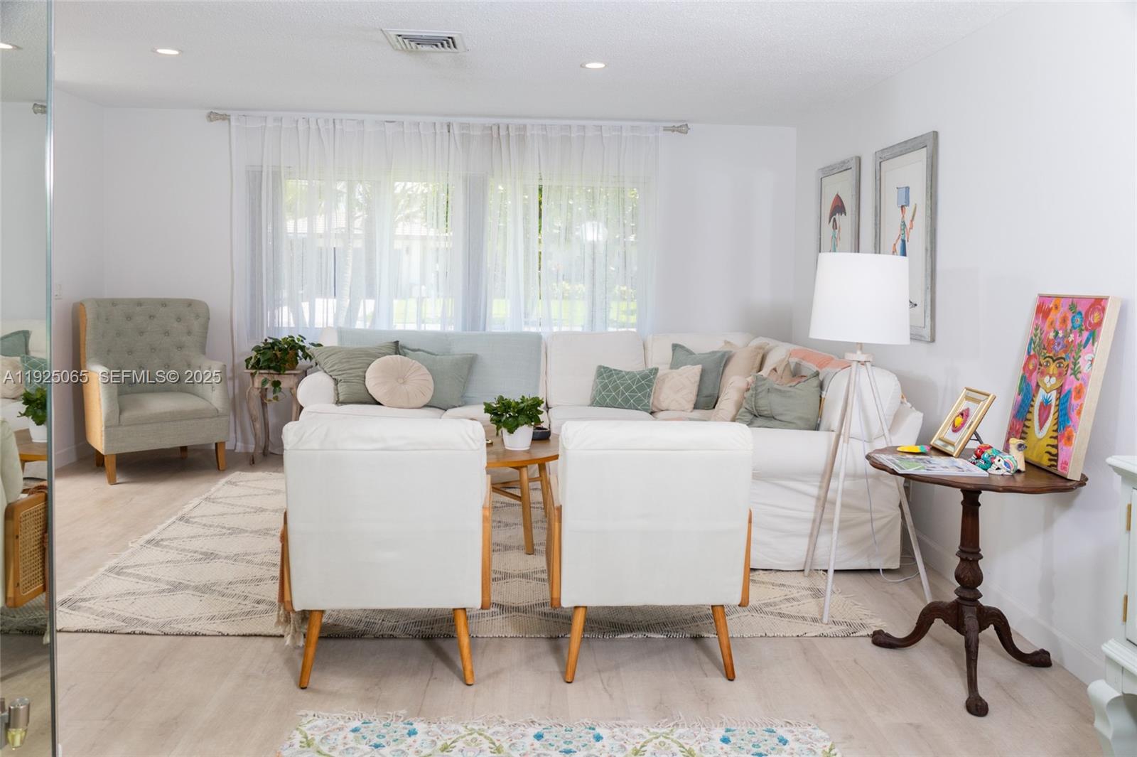 107 Winged Foot Lane Boca Raton, FL 33431 - Photo 12 of 46 a living room with furniture and a chair