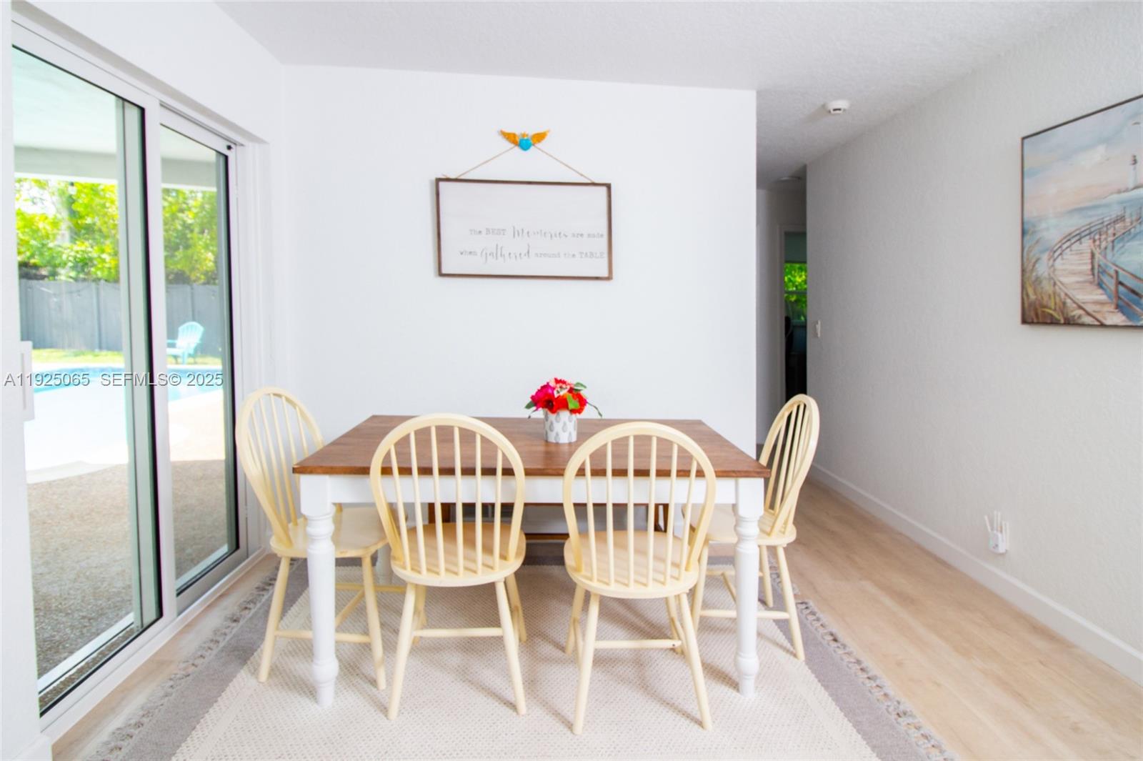 107 Winged Foot Lane Boca Raton, FL 33431 - Photo 14 of 46 a view of a dining room with furniture a potted plant and outside view