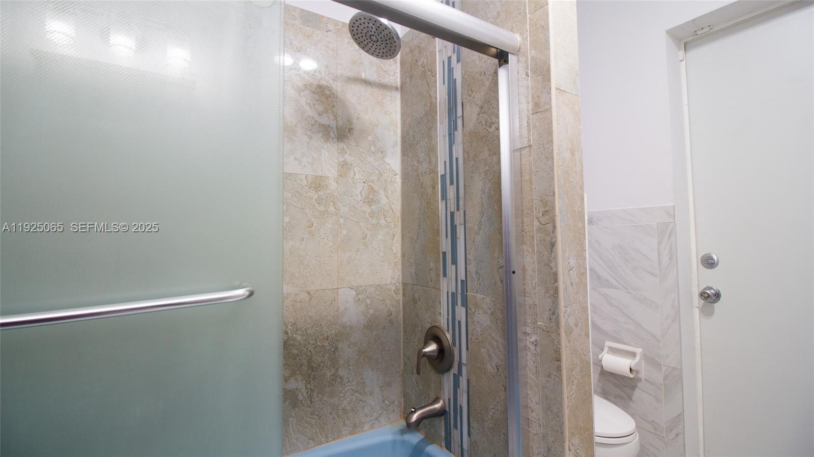 107 Winged Foot Lane Boca Raton, FL 33431 - Photo 23 of 46 a bathroom with a shower and a mirror