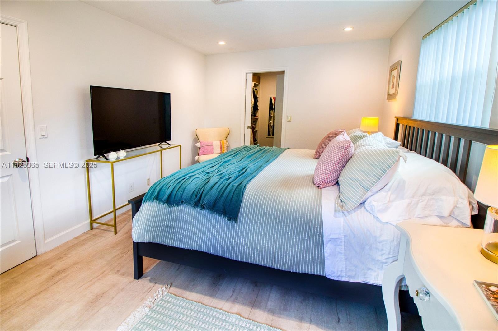 107 Winged Foot Lane Boca Raton, FL 33431 - Photo 32 of 46 a bedroom with a bed and a flat screen tv