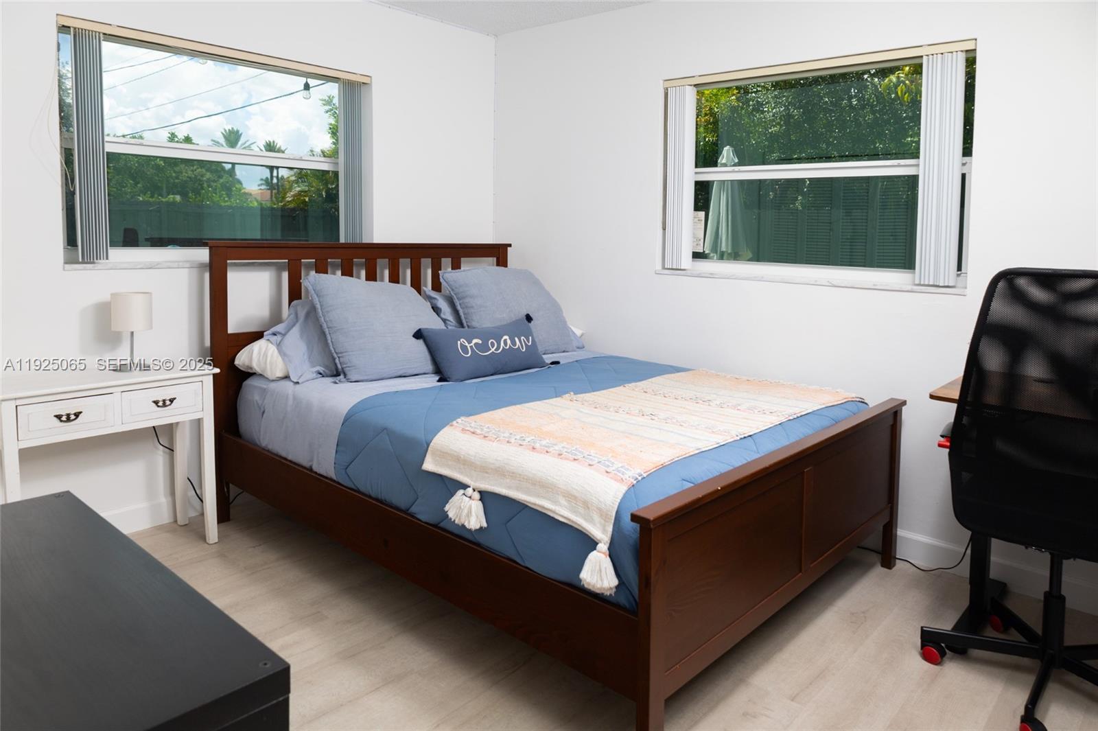 107 Winged Foot Lane Boca Raton, FL 33431 - Photo 34 of 46 a bedroom with a bed and a window