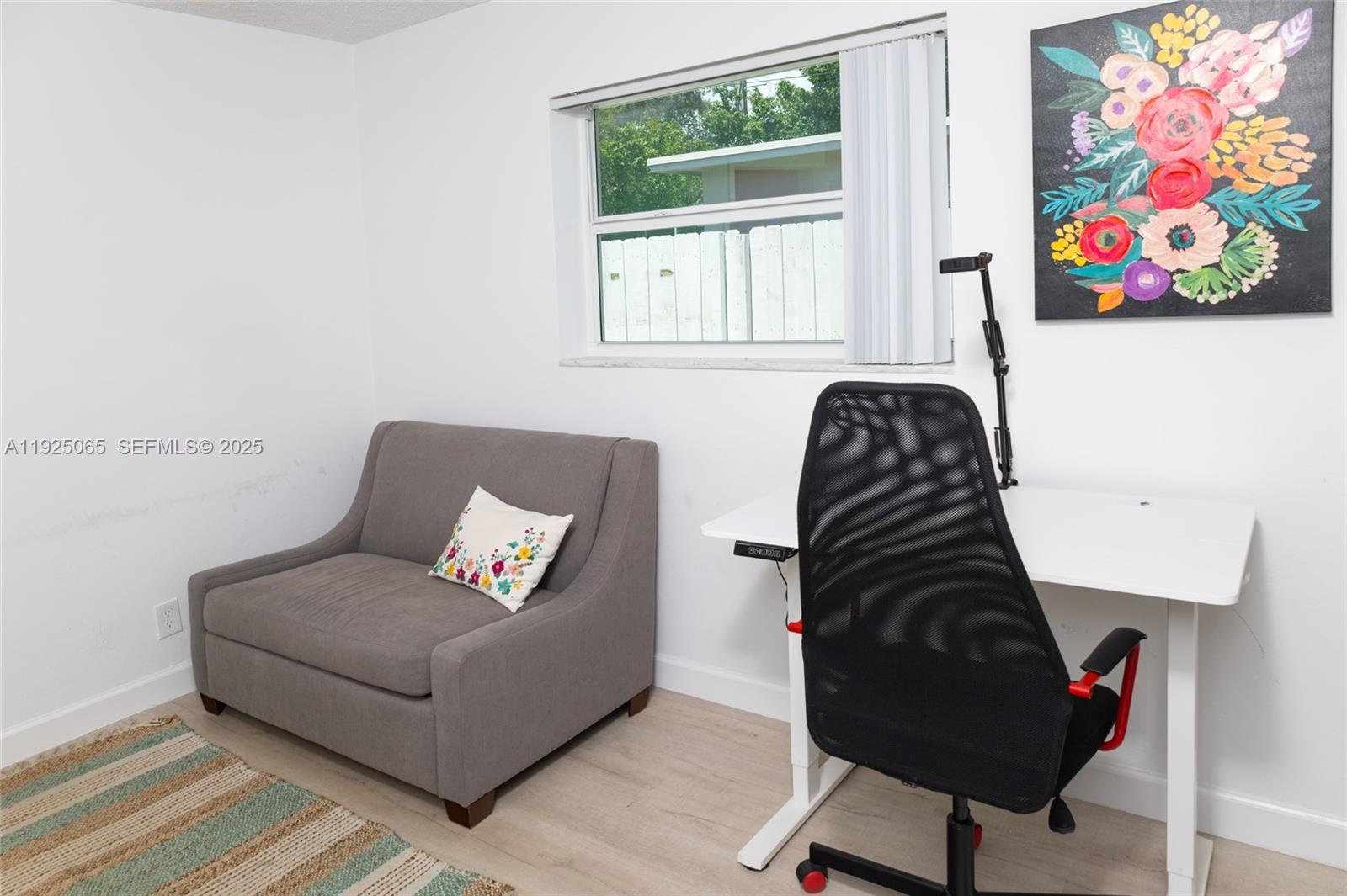107 Winged Foot Lane Boca Raton, FL 33431 - Photo 39 of 46 a living room with furniture and a painting on the wall