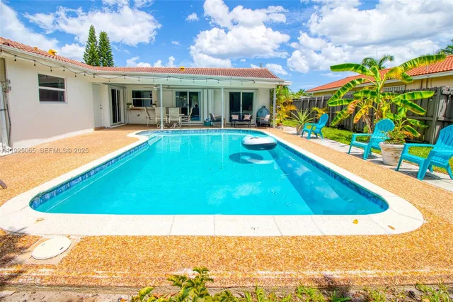a view of a house with swimming pool
