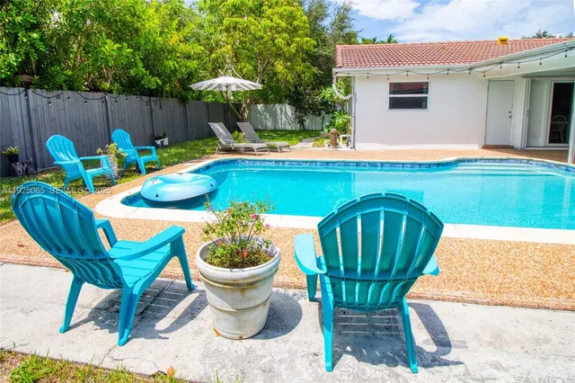 a view of outdoor sitting area with furniture and garden