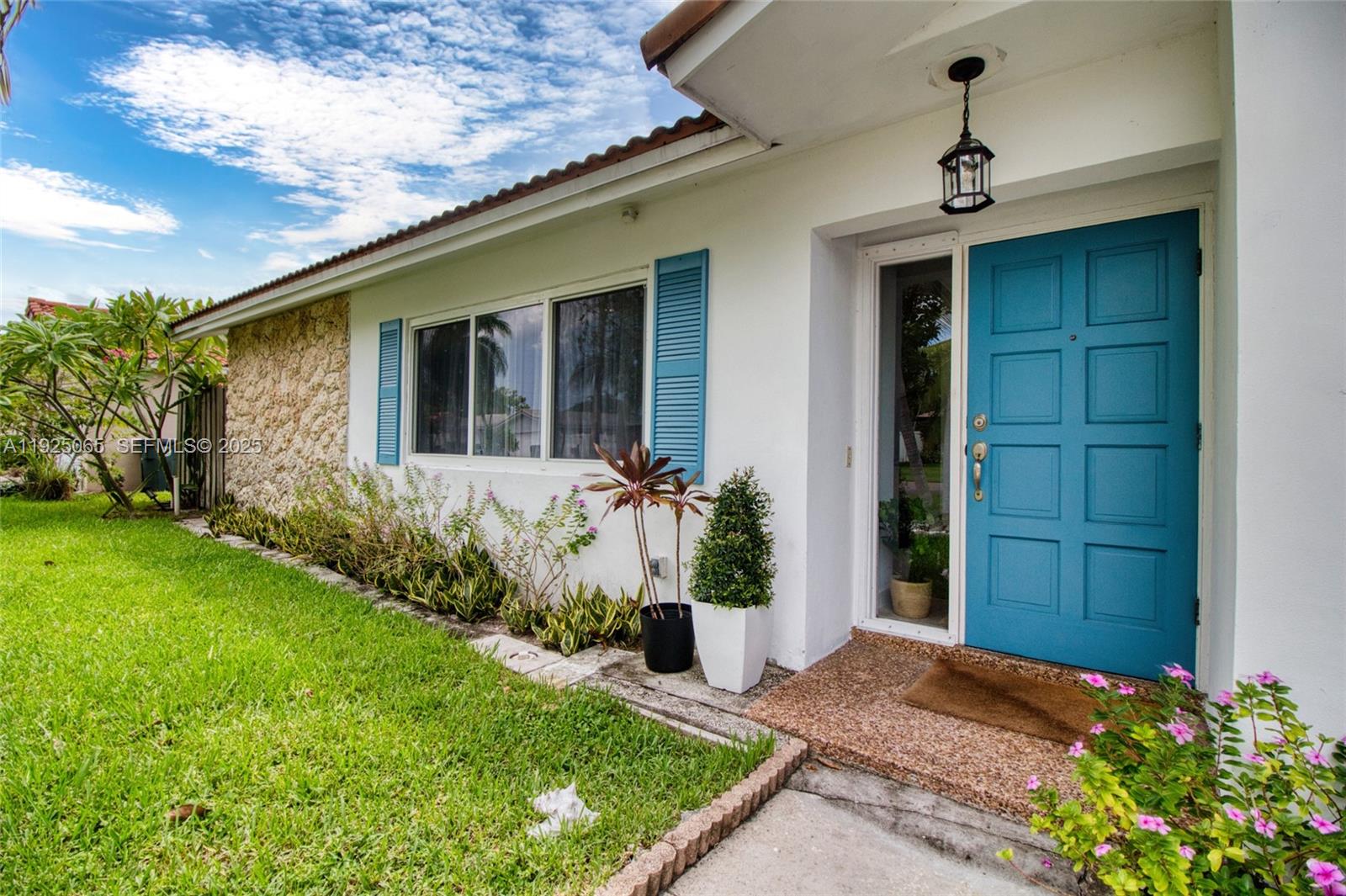 107 Winged Foot Lane Boca Raton, FL 33431 - Photo 7 of 46 a front view of a house with garden