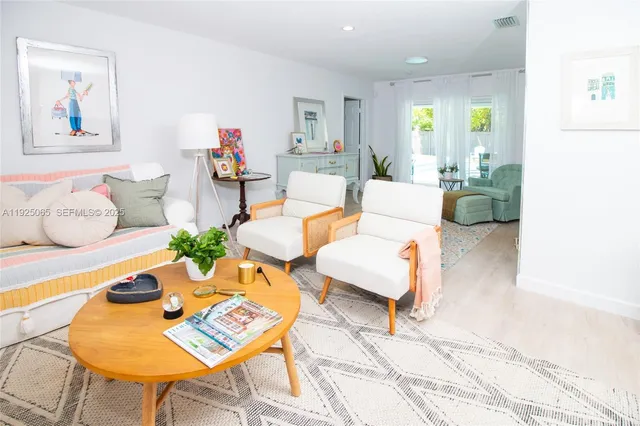 a living room with furniture and a rug
