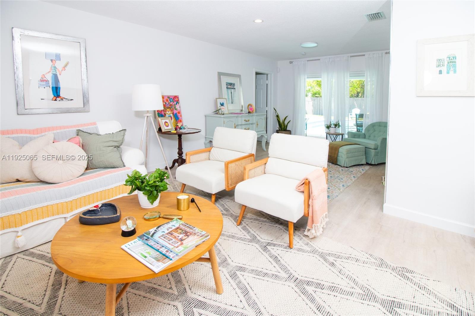 107 Winged Foot Lane Boca Raton, FL 33431 - Photo 8 of 46 a living room with furniture and a rug