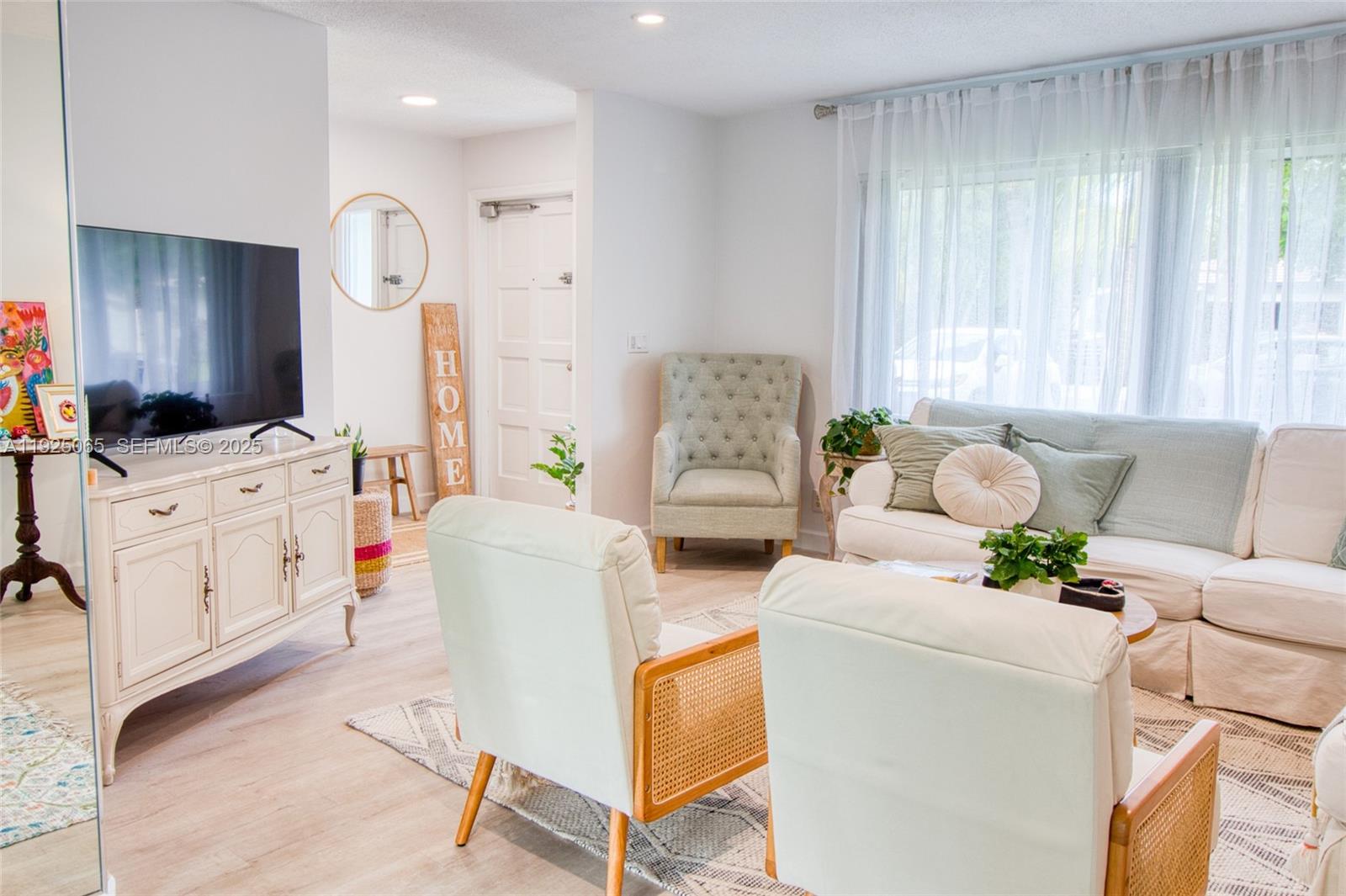 107 Winged Foot Lane Boca Raton, FL 33431 - Photo 10 of 46 a living room with furniture and a large window
