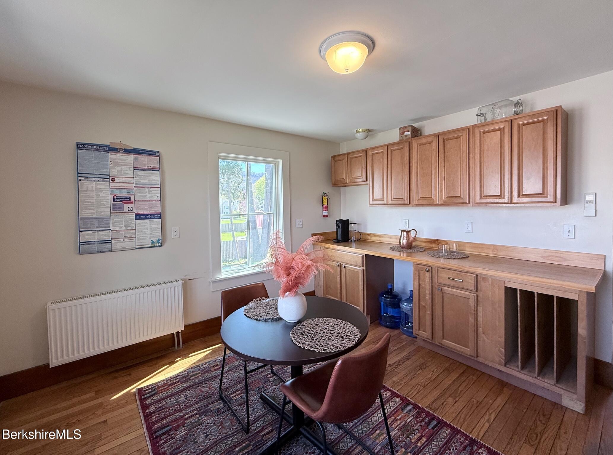 783 Main Street Great Barrington, MA 01230 - Photo 11 of 31 a open kitchen with stainless steel appliances granite countertop a stove a sink dishwasher and cabinets with wooden floor